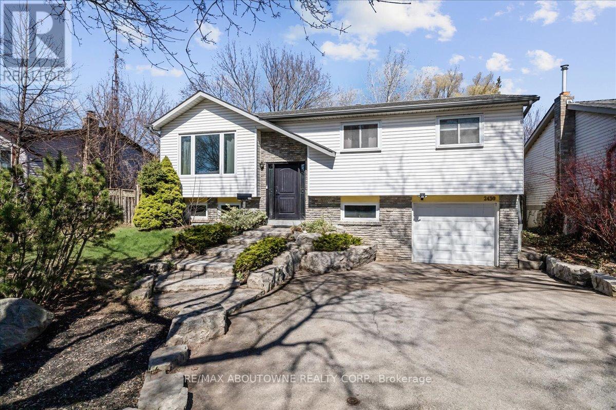 Welcome to 2430 Cavendish Road - Nestled in the highly sought-after Brant Hills community, this beautifully updated raised bungalow combines modern design with practical living. Offering 3+1 bedrooms and 2 full bathrooms and over 2000 sq feet of living space, this home features a fully finished lower level with a separate entrance perfect for families, first-time buyers, or those looking to downsize. Step inside to discover a bright and spacious open-concept main floor highlighted by rich Brazilian hardwood flooring and a sun-filled living room with a large picture window. The contemporary eat-in kitchen is a chefs delight, showcasing stainless steel appliances, Caesarstone countertops, a generous center island, and ample cabinetry. From here, walk out to a private deck and serene backyard that backs onto lush greenspace an ideal setting for relaxation or entertaining. The main level also includes three generously sized bedrooms and a beautifully updated 4-piece bathroom with soaker tub. The lower level offers incredible versatility, featuring a cozy recreation room with a fireplace, a 4th bedroom or den/office with above-grade windows, a 3-piece bathroom, a laundry room, and direct access to the extra-deep single garage. Enjoy outdoor living in the expansive backyard perfect for hosting, playing, or unwinding. With parks, schools, shopping, public transit, and easy highway access all nearby, this home offers the perfect blend of comfort, style, and convenience. Welcome home to Brant Hills. (id:48254)