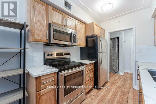 203 - 11 Woodman Drive S, Hamilton (Corman), Ontario  L8K 4E3 - Photo 5 - X12092153