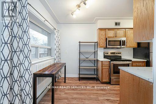 203 - 11 Woodman Drive S, Hamilton (Corman), Ontario  L8K 4E3 - Photo 6 - X12092153