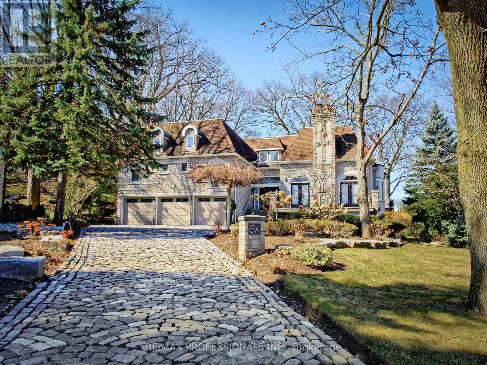 Welcome to 6A Edenbrook Hill in Lincoln Wood  Edenbridge Humber Valley. This impeccably thoughtful stone estate is situated in one of Torontos most coveted enclaves overlooking St Georges Golf & Country Club. A cobble stone circular drive welcomes to the 3-car garage and an exterior that exudes a chateau inspired architectural feel. Inside opens to approx 8600sq ft of living space with soaring ceilings, bright skylights and new hardwood flooring with herringbone design complete with a new glass staircase with floating steps. A sunken family room overlooking the front terrace offers privacy and a cozy feel. Main floor office space with new custom shelves and flooring with large loft space above with panoramic windows. Sun-soaked chefs kitchen with contemporary design combines with the living area complete with a new porcelain feature wall providing spectacular views of the third hole of St Georges Golf Course. 4+1 bedroom & 7-bathroom layout includes a primary bedroom suite on the main floor with a private terrace overlooking the course. The lower level is perfect for entertaining (Canadian open?) with a complete second kitchen, bar area and games room with a walk out to the private rear garden. Gym, sauna with a wine cellar not to be missed! Timeless design in irreplaceable location! (id:48254)