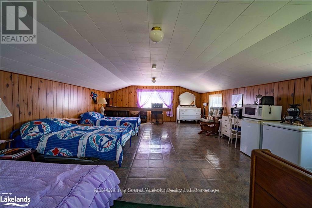 2235 Hwy 124, Whitestone, Ontario  P0A 1G0 - Photo 21 - X12100008