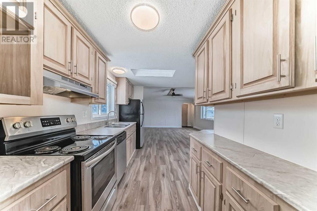 203 Burroughs Circle Ne, Calgary, Alberta  T1Y 6K8 - Photo 5 - A2213007