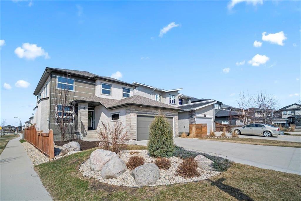 4 Kelly Place Winnipeg, Manitoba 1H//Winnipeg/SS NOW | Offers ANYTIME!!!! | OPEN HOUSES CANCELLED | This former Broadview show home looks like it stepped out of a magazine! From the moment you walk in, the front entry welcomes you w/ a separate mudroom/laundry area and direct garage access (20x22). The main floor offers a stunning open-concept layout w/ 8' quartz island, high-end stainless appliances, and a spacious dining/living area w/ a custom gas fireplace media wall. Enjoy loads of natural light from the West-facing backyard and a seamless indoor-outdoor vibe w/ a 3-panel patio door. UPGRADES everywhere! Triple-pane windows, built-in speaker system, custom blinds, luxury ensuite just to name a few. Upstairs you ll find 3 bedrooms, 2 full baths, and a versatile loft that could easily become a 5th bedroom. The primary includes a walk-in closet and a spa-inspired ensuite. The fully finished, fully permitted basement adds even more living space w/ a large rec room/gym, 4th bedroom, 4-piece bath, utility/storage area, and a dedicated kids playroom or toy storage space. Outside, you ll find custom landscaping front and back, a large deck, and no rear neighbours just peaceful green space views. A rare gem in Ridgewood!! (id:48254)