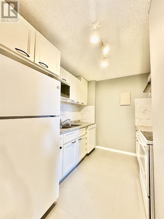 702, 4944 Dalton Drive Nw, Calgary, Alberta  T2W 6J3 - Photo 8 - A2213402