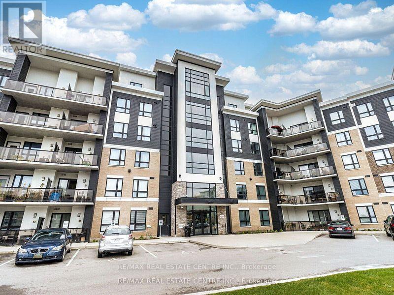 406 - 630 Sauve Street, Milton, Ontario  L9T 9A6 - Photo 3 - W12068356