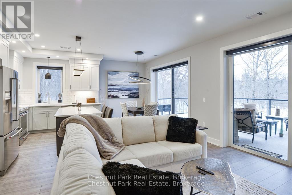 404 - 18 Campus Trail, Huntsville, Ontario P1H 0K2 - Photo 2 - X12120113