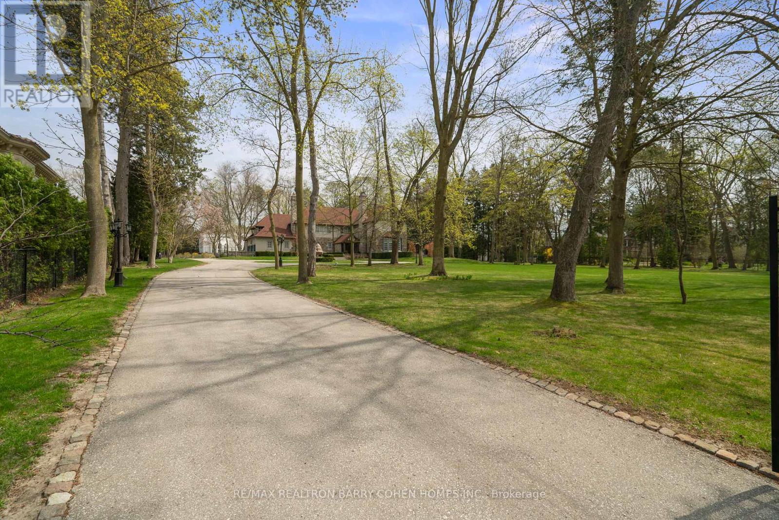 15 Park Lane Circle Toronto (Bridle Path-Sunnybrook-York Mills), Ontario Nestled In Torontos Most Prestigious Neighbourhoods - The Bridle Path. This Exquisitely Renovated Tudor-Style Mansion Blends Old-World Charm With Modern Sophistication. Set On A Sprawling Gated Manicured Estate West Facing 2 Acre Lot. This Stately Residence Captures The Essence Of Refined Living With Its Classic Architectural Details And Thoughtfully Updated Interiors. Just Recently Updated By Renowned Greengold Construction With New Kitchen, Servery, Bathrooms, Lighting, Millwork, Reclaimed Solid Hardwood Floors, Complete Lower Level With Theatre Room, Home Automation, Security, Irrigation & More. The Home Exudes Timeless Character And Historic Elegance. Designer Wallpaper, Ornate Crown Moldings, Intricate Wood Paneling, Multiple Fireplaces And Multiple Walkouts To The Sprawling Gardens Make This A One Of A Kind Offering. The Gourmet Kitchen, Reimagined With Bespoke Cabinetry And Top-Of-The-Line Appliances, Is A Perfect Marriage Of Tradition And Innovation. Lavish Formal Principal Rooms Offer Effortless Flow For Both Intimate Gatherings And Grand-Scale Entertaining. Upstairs, The Palatial Primary Suite Boasts A Marble Ensuite And While Additional Guest And Family Suites Offer Refined Comfort Throughout. Luxury Hotel Lobby-Like Lower Level Includes Ample Storage, A Lounge, Bar, Nanny Quarters And A Theatre. Outside, The Estate Unfolds Into A Secluded Retreat, Complete With Formal Gardens, Motor Court, A Terrace And A Refurbished Tennis Court. Offering The Grandeur Of A Bygone Era With All The Amenities Of Modern Luxury, This Rare Bridle Path Masterpiece Is Truly One Of A Kind. (id:48254)
