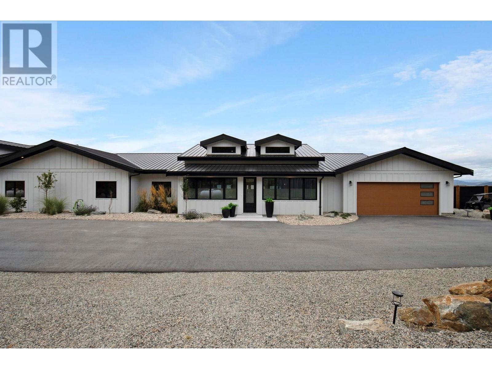 2137 Carmi Road Penticton, British Columbia Nestled in the heart of the Okanagan Valley, renowned for its sun-drenched vineyards and picturesque landscapes, this stunning new luxury estate rancher offers an unparalleled lifestyle for both relaxation and entertainment! Enjoy breathtaking views of the City and both Okanagan and Skaha Lake. Ideal for entertaining the home boasts a pool, hot tub, outdoor kitchen. For car buffs the property includes an 40 x 60 workshop/car barn with over height door plus garages for both the living spaces. The home features two distinct wings- the main wing encompasses an ample living space with a one-of-a-kind kitchen perfect for culinary enthusiasts, master bedroom with amazing ensuite and closet space, a gym and two studio/workspaces. The other wing has its own kitchen, additional bedrooms and a den. The wings and be divided to create two separate living quarters. Tons of parking space is available for your recreational vehicles and toys and a 600 amp electrical service. This property has everything you need to enjoy the Okanagan lifestyle to the fullest. (id:48254)