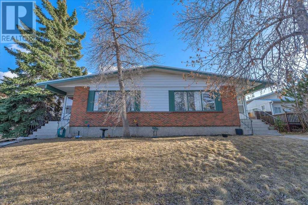 7321 & 7323 Huntertown Crescent Nw, Calgary, Alberta  T2K 4K3 - Photo 6 - A2208983