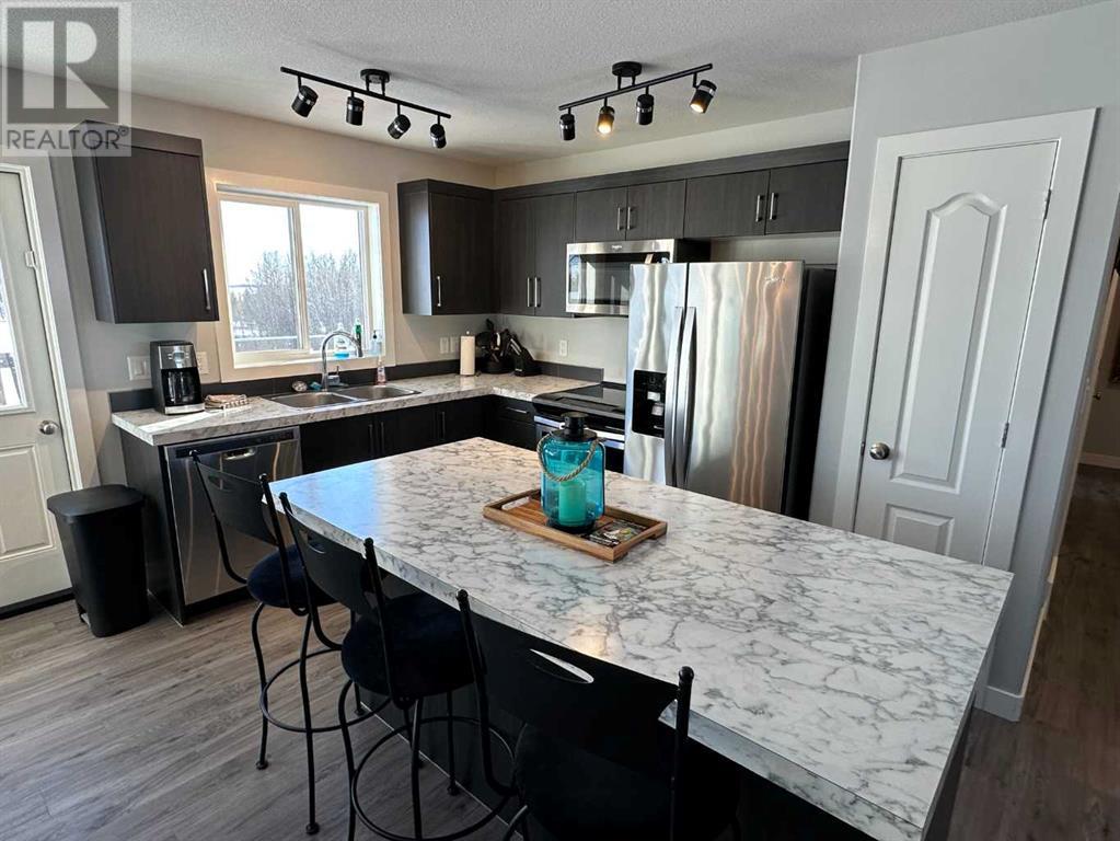 50 Sunnyside Crescent, Rural Ponoka County, Alberta  T0C 2J0 - Photo 2 - A2189563