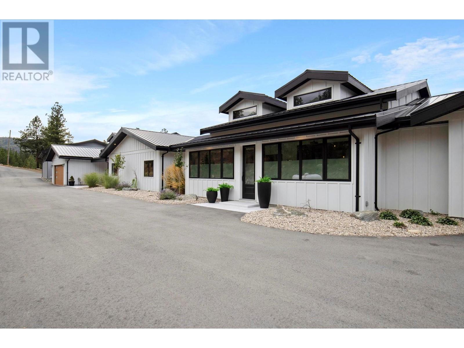 2137 Carmi Road Penticton, British Columbia Nestled in the heart of the Okanagan Valley, renowned for its sun-drenched vineyards and picturesque landscapes, this stunning new luxury estate rancher offers an unparalleled lifestyle for both relaxation and entertainment! Enjoy breathtaking views of the City and both Okanagan and Skaha Lake. Ideal for entertaining the home boasts a pool, hot tub, outdoor kitchen. For car buffs the property includes an 40 x 60 workshop/car barn with over height door plus garages for both the living spaces. The home features two distinct wings- the main wing encompasses an ample living space with a one-of-a-kind kitchen perfect for culinary enthusiasts, master bedroom with amazing ensuite and closet space, a gym and two studio/workspaces. The other wing has its own kitchen, additional bedrooms and a den. The wings and be divided to create two separate living quarters. Tons of parking space is available for your recreational vehicles and toys and a 600 amp electrical service. This property has everything you need to enjoy the Okanagan lifestyle to the fullest. (id:48254)