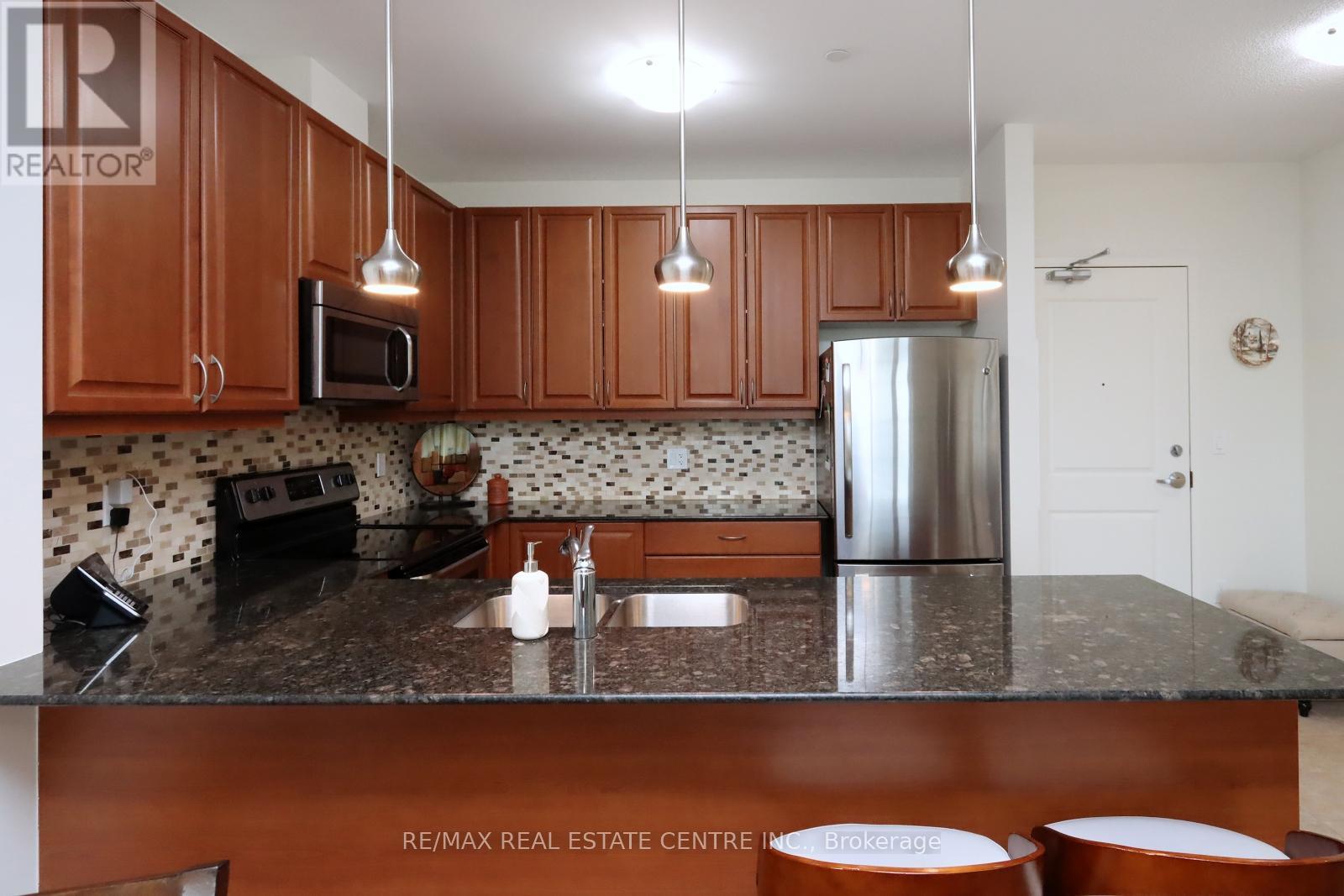 406 - 33 Whitmer Street, Milton, Ontario  L9T 8P9 - Photo 10 - W12127471