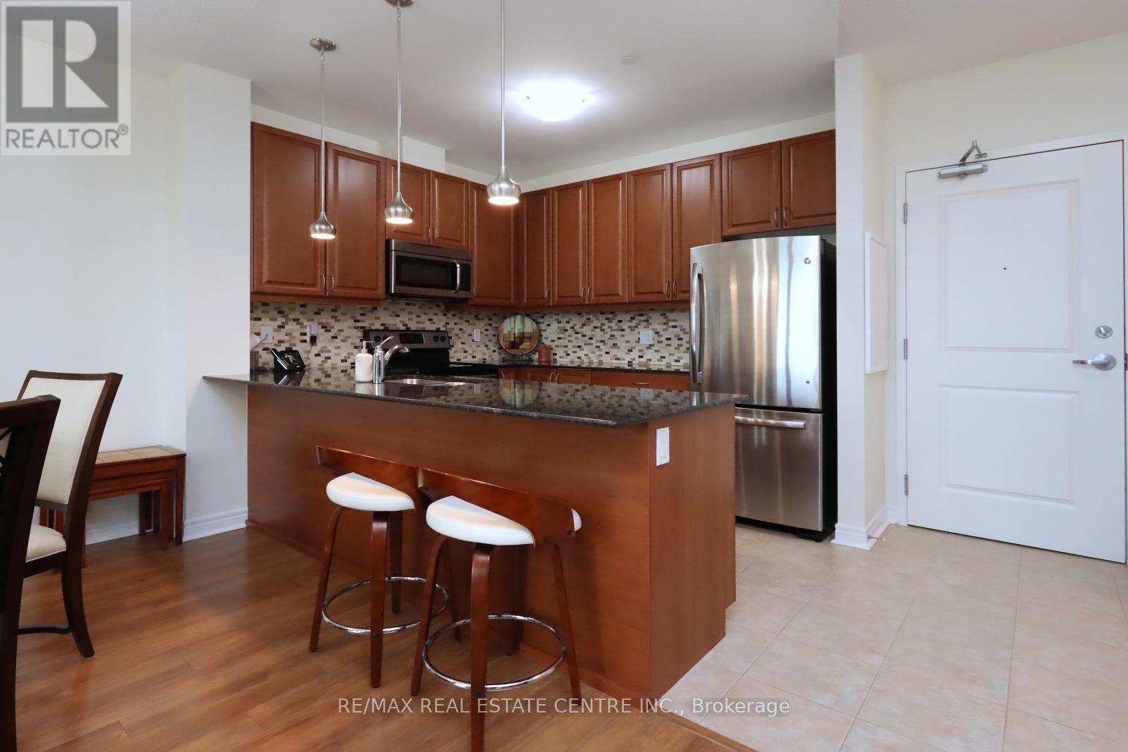 406 - 33 Whitmer Street, Milton, Ontario  L9T 8P9 - Photo 11 - W12127471