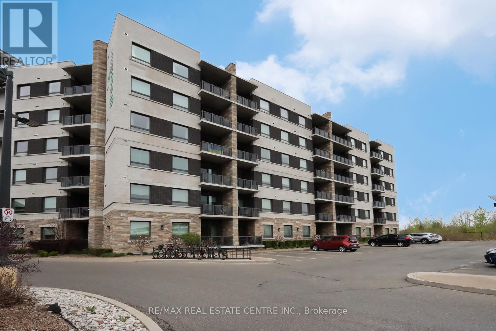 406 - 33 Whitmer Street, Milton, Ontario  L9T 8P9 - Photo 2 - W12127471