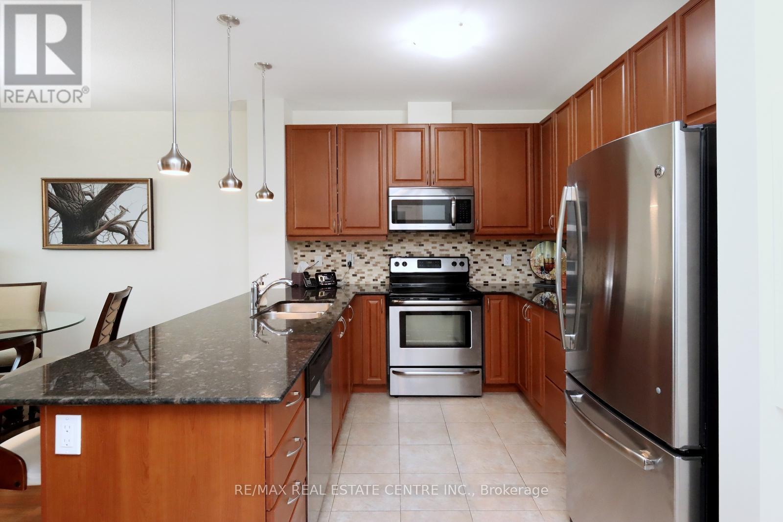 406 - 33 Whitmer Street, Milton, Ontario  L9T 8P9 - Photo 8 - W12127471