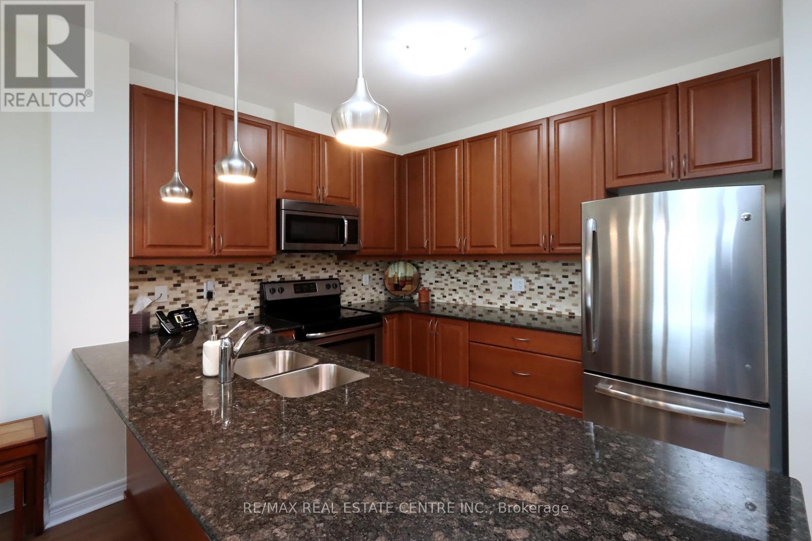 406 - 33 Whitmer Street, Milton, Ontario  L9T 8P9 - Photo 9 - W12127471