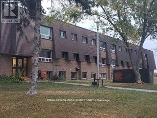 112 - 260 Academy Street, Loyalist, Ontario  K0H 1G0 - Photo 2 - X12128139