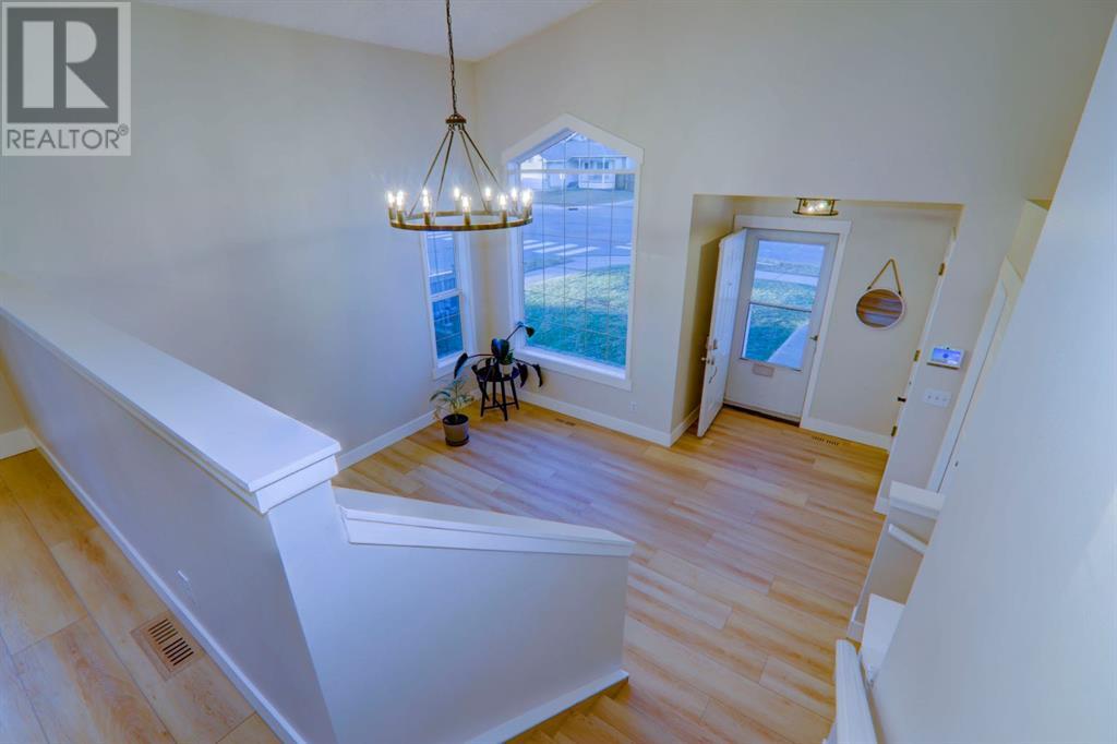 67 Cimarron Drive, Okotoks, Alberta  T1S 1S6 - Photo 8 - A2218564