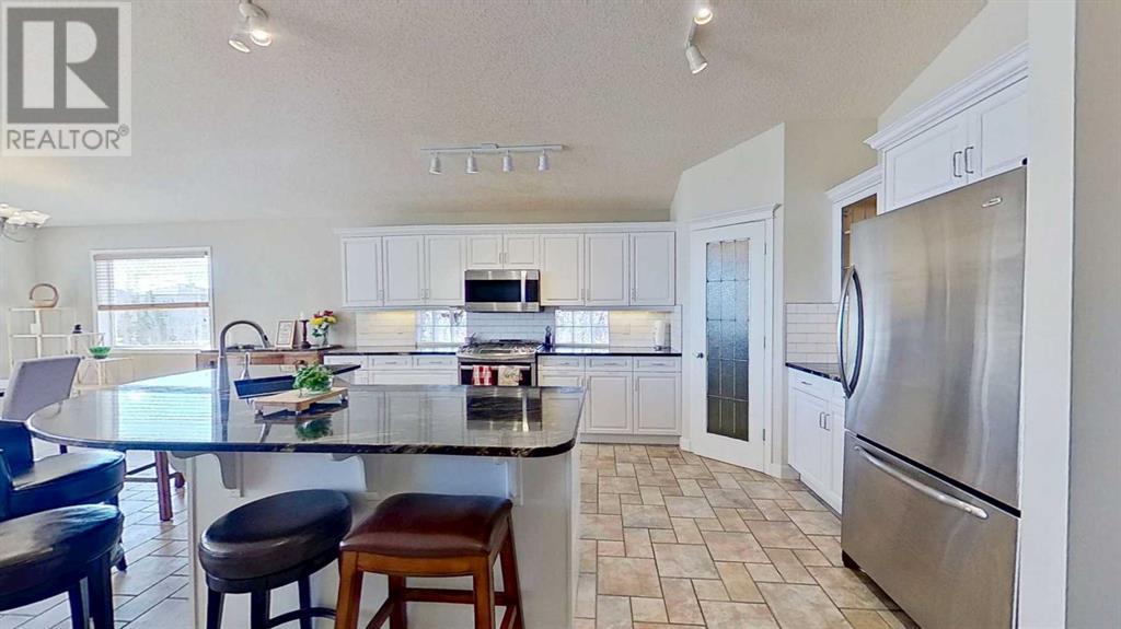 117 Springmere Drive, Chestermere, Alberta  T1X 1J3 - Photo 5 - A2218196