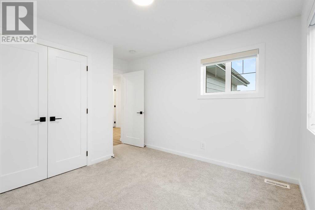 296 Spring Creek Circle Sw, Calgary, Alberta  T3H 6G4 - Photo 26 - A2218176