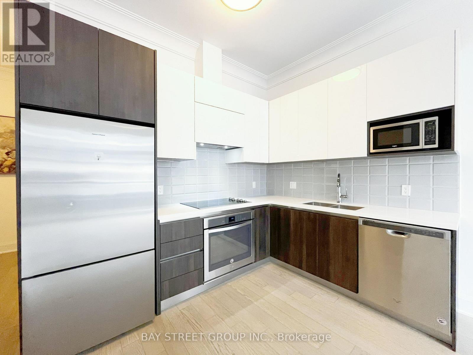 201 - 25 Water Walk Drive, Markham, Ontario  L6G 0G3 - Photo 7 - N12132594
