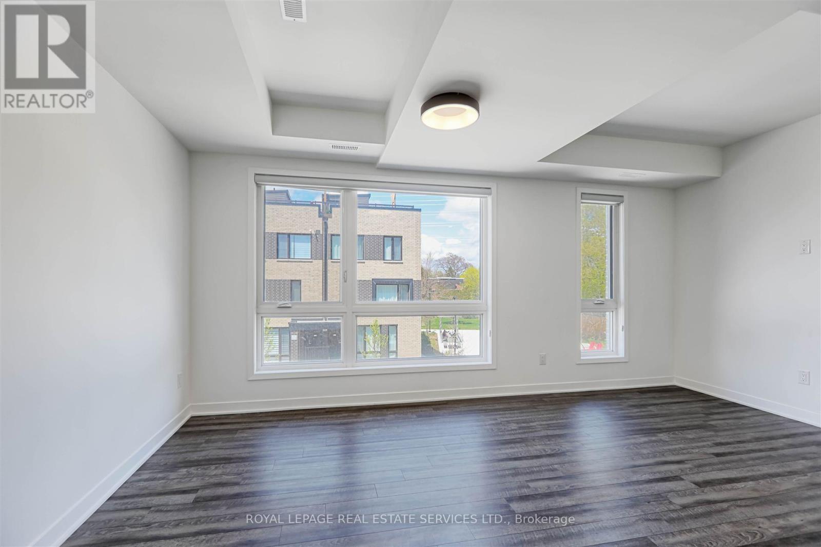 Th24 - 40 Ed Clark Gardens, Toronto, Ontario  M6N 0B5 - Photo 2 - W12046107