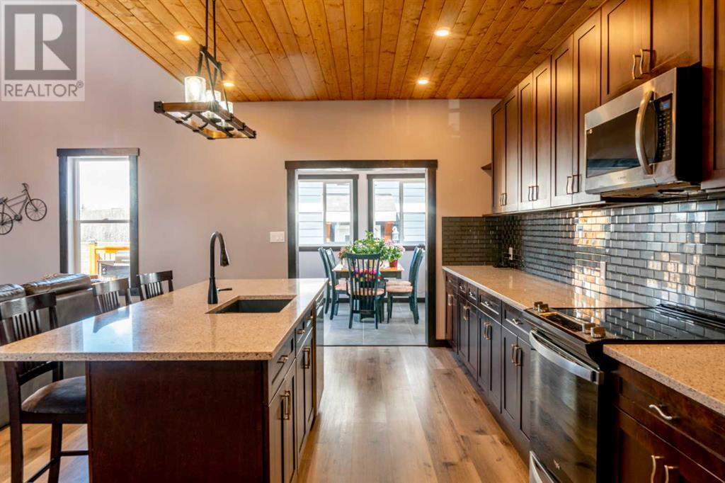 216 Cottageclub Crescent, Rural Rocky View County, Alberta  T4C 1C3 - Photo 6 - A2204834