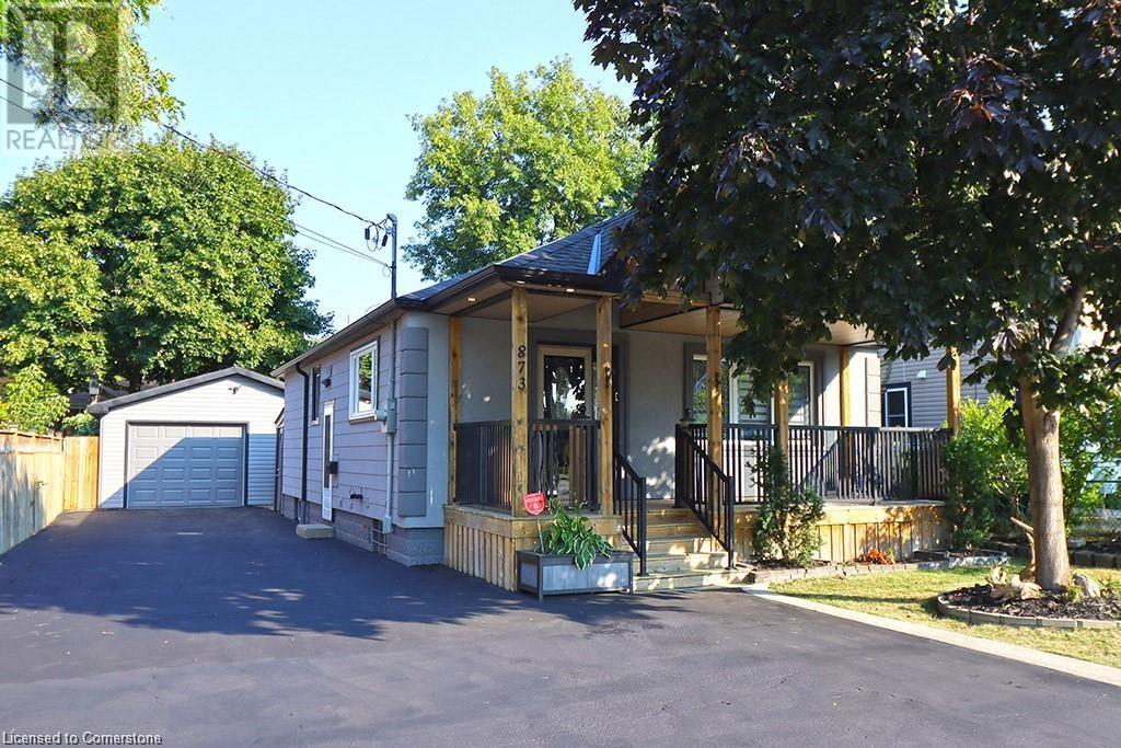 INTRODUCING A STUNNING RENOVATED BUNGALOW THAT EXUDES URBAN ELEGANCE. This exquisite 2+1-bedroom, 3-bathroom bungalow offers an exceptional living experience with its thoughtful design, modern amenities, and prime location. With an over sized garage and convenient driveway parking, your parking needs are effortlessly met. Step inside and be greeted by a wealth of natural light that accentuates the new flooring throughout. The living space has been artfully redesigned into an open concept layout, seamlessly connecting the living and dining area with a custom-designed kitchen. Boasting stainless steel appliances and a spacious island, this kitchen is a hub of culinary creativity. The allure of this home is elevated by meticulously chosen light fixtures and a sophisticated electric fireplace on the main floor that adds a touch of warmth and ambiance to your gatherings. Discover two generously sized bedrooms that provide privacy and comfort. The pinnacle of this property lies beyond the 1978 square feet of total living space, where a private porch and backyard deck with dry bar beckons— spacious outdoor living spaces that extends your abode and offers tranquil escape. Positioned ideally for convenience, this home is adjacent to a plethora of shopping options, parks, schools and public transportation. Don't miss the chance to own this one-of-a-kind, fully renovated gem that harmonizes stylish living with urban accessibility. (id:48254)