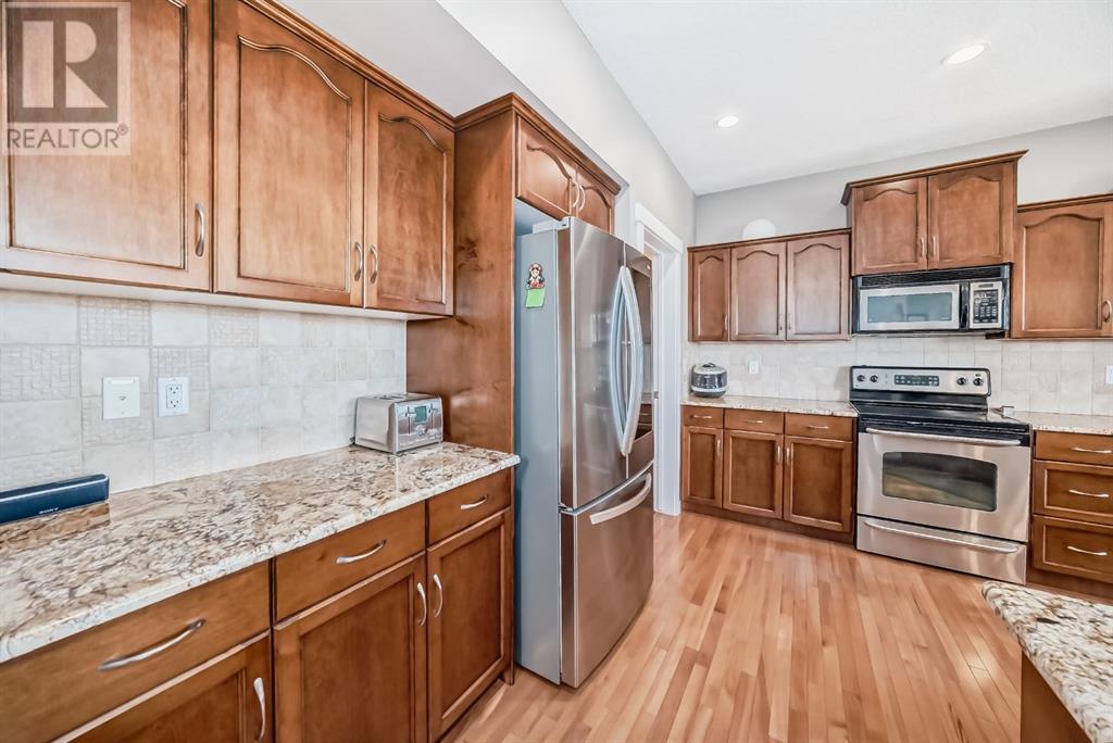 626 Coopers Drive Sw, Airdrie, Alberta  T4B 3M3 - Photo 3 - A2220598