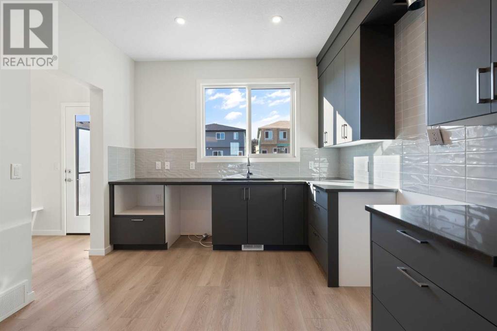 969 Creekview Drive Sw, Calgary, Alberta  T2X 5X6 - Photo 11 - A2202280