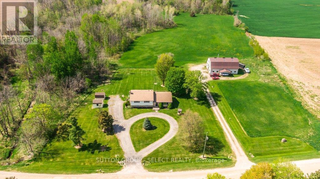 17750 Wyton Drive Thames Centre, Ontario Welcome to this country charmer with just over 7 acres of land with a house, barn and 2 storage sheds. The land breaks down to approx 1.5 acres of mature bush, 3.5 acres of workable land and 2.1 acres for the house and out buildings. With an Ag Zoning your options are many as to how to imagine all its potential uses. The barn is a 50'x34.6' steel-clad building in excellent repair and features two end slide doors, 2 man-doors, hydro, concrete floor, 2 stalls, and a high and dry loft. This space is begging to be developed into something special! The house offers 4 bedrooms incl a large owner's suite with 2 pc private ensuite and large dual closets. The main floor is an open concept space with a large country kitchen, dining area and living room with southern exposure. Down on the lower level is a super-spacious family room with wood fireplace and large laundry closet. Lastly the unfinished utility room offers loads in-home storage, a workbench, and a walk-out to the side driveway. You can easily imagine a future attached garage entering in to an over-sized boot room. So many possibilities! The circular drive in front of the house, side house drive space and the separate laneway to the barn can hold a fleet so no juggling cars in the morning. Located just minutes east of London only minutes to Thorndale, Thamesford, 401 and all major amenities. Call your agent now and schedule a showing before it's too late. NOTE: all appliance included in as is condition. Heat and water in barn currently not operational but can be revived. these will be an purchaser's expense. Also that your agents commission will be reduced should you book a private showing through the listing agent and offer through another. call your agent to see or visit during an open house to avoid this scenario. (id:48254)