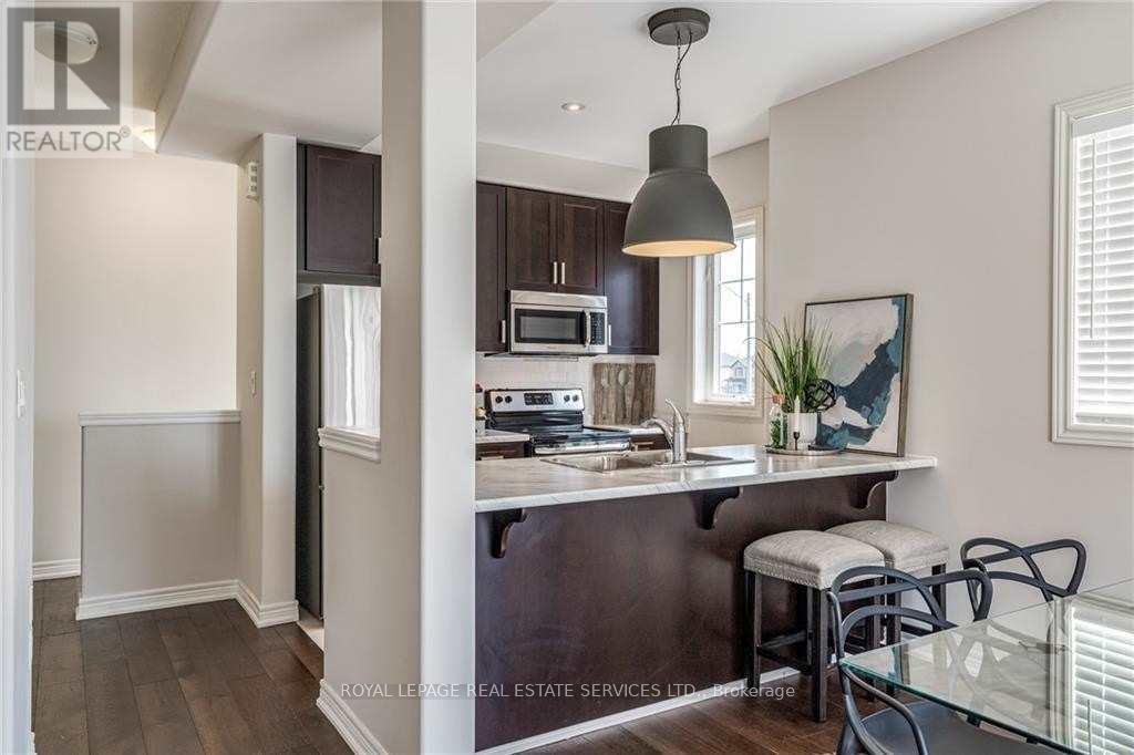 47 - 201 Westbank Trail, Hamilton, Ontario  L8J 0H4 - Photo 5 - X12146383