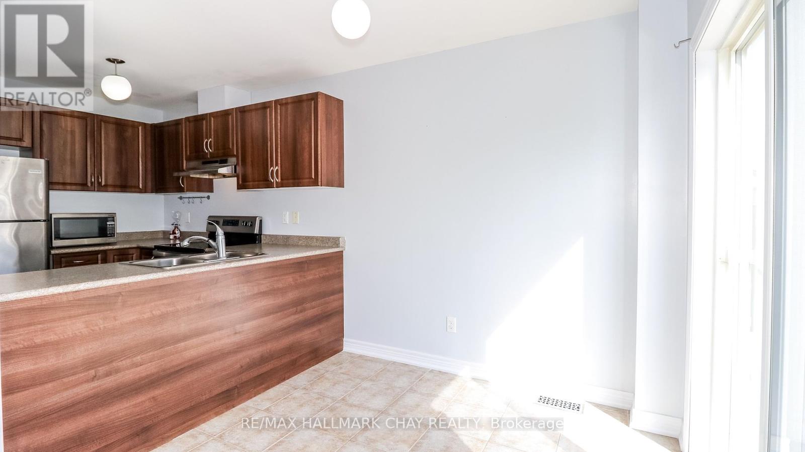 161 Greenwood Drive, Essa, Ontario  L0M 1B4 - Photo 15 - N12148527
