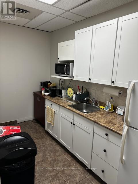 200 - 235 Lakeshore Road E, Oakville, Ontario  L6J 1A7 - Photo 10 - W12151629
