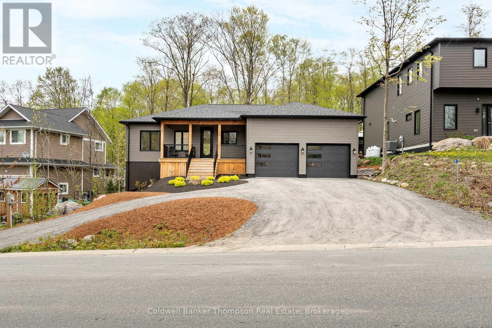 <div class="slider-price">$1,229,900</div><p>14 Mackenzie Drive, Huntsville, Ontario</p>