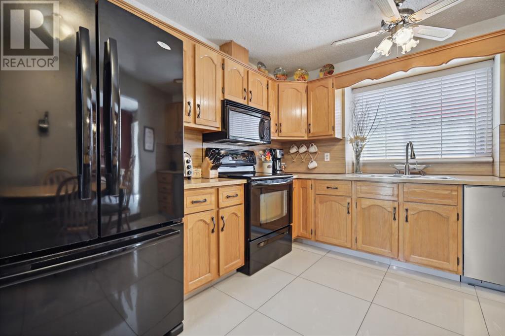 2407 98 Avenue Sw, Calgary, Alberta  T2V 4S7 - Photo 8 - A2220758