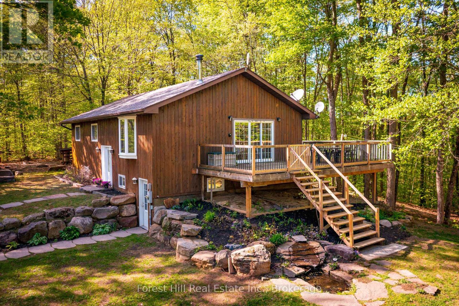 Two Homes!!  on this five beautiful wooded acres, located on a year round maintained road just minutes past the Deerhurst Resort and the Hidden Valley Ski hills. Both homes are in excellent condition with beautiful modern touches!  This property gives a new home owner many options, live in one home and rent out the other? or keep a second home for extended family? Keep a second home for Airbnb rental income in this gorgeous Muskoka tourist area. Minutes to free public boat launches on Lake of Bays or Peninsula Lake. The newer one bedroom home built in 2015 is currently occupied by a monthly tenant, the Four bedroom bungalow is vacant and ready to move into, easy to view anytime!!!  Dont miss this rare Two Home property. OPEN TO OFFERS. (id:48254)