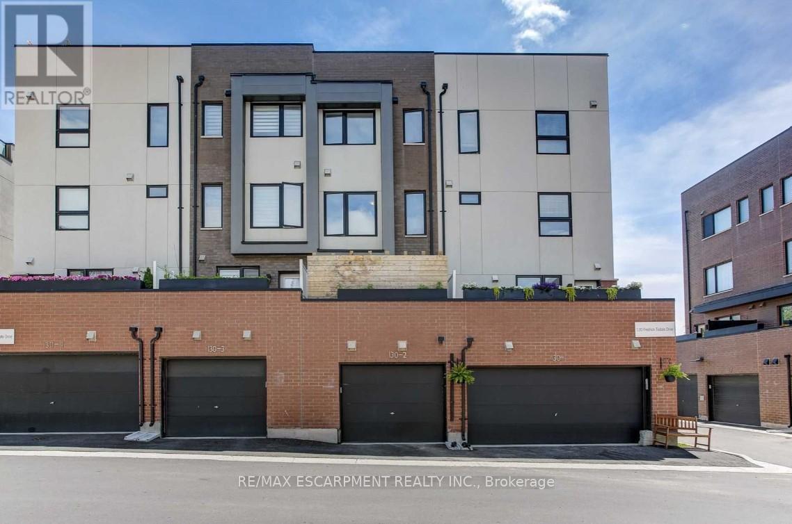 2 - 130 Frederick Tisdale Drive, Toronto, Ontario  M3K 0A5 - Photo 1 - W12158957