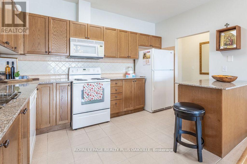 403 - 1499 Nottinghill Gate, Oakville, Ontario  L6M 5G1 - Photo 6 - W12164432