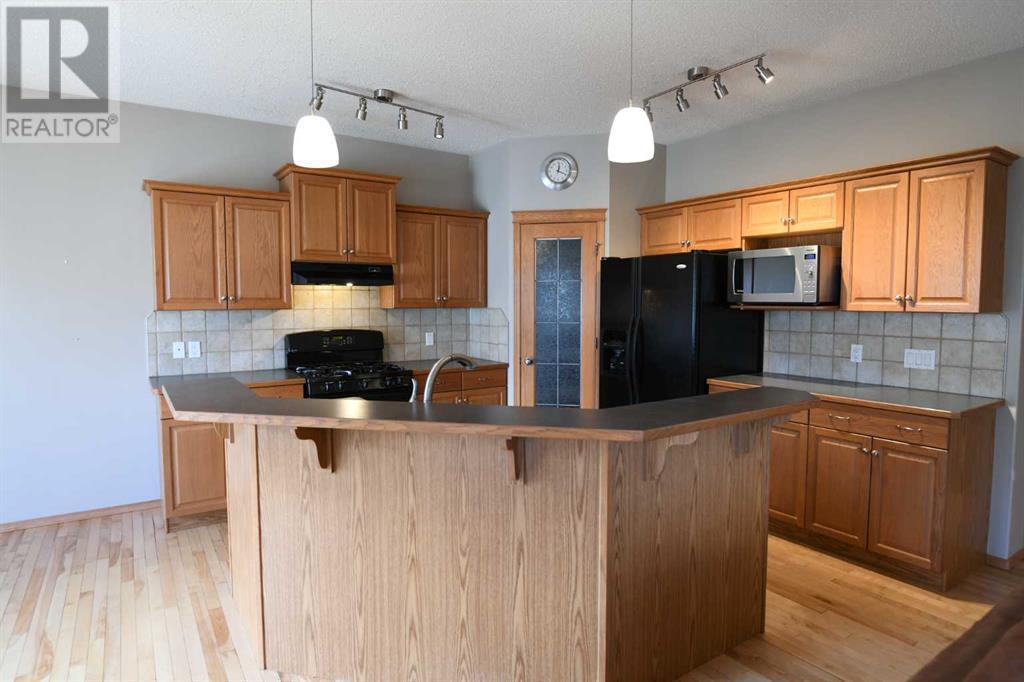 2825 Coopers Manor Sw, Airdrie, Alberta  T5B 3J8 - Photo 7 - A2221036