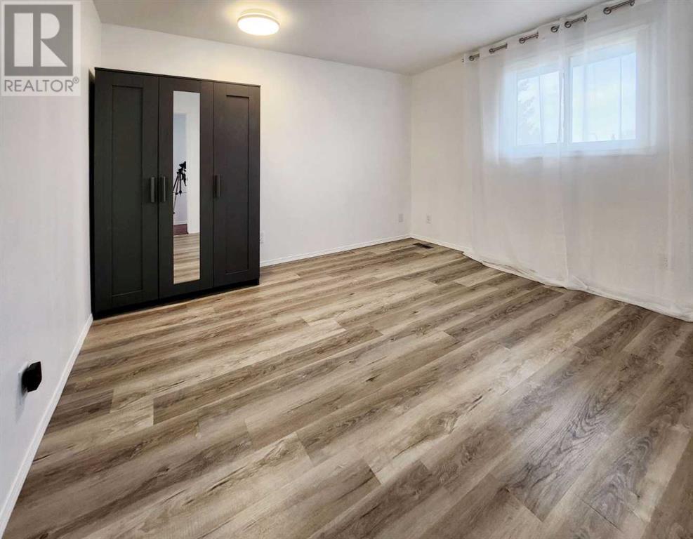 59 Woodmont Way Sw, Calgary, Alberta  T2W 4L7 - Photo 21 - A2220414