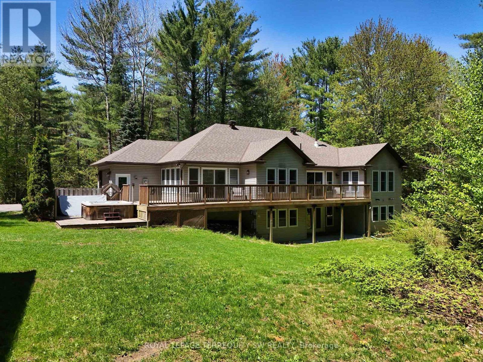 Live the good life on a huge parcel of land with mature trees in a prime Muskoka location. Absolutely stunning and spotless custom home on private 4 acre lot located on coveted Cedar Lane & only a 5 minute walk to High Falls & Trans Canada Trail and minutes to downtown Bracebridge. Custom built in 2006 and renovated in 2021 offering well over 3000+ SqFt of sprawling living space over two levels. Open concept main floor design offers wonderful natural lighting through lots of south facing windows, 2 walkouts, hardwood floors, wood burning fireplace in the living room plus walk out to deck, gourmet style kitchen with gas range, large center island with breakfast bar, formal dining area + a gorgeous sun drenched 4 season Muskoka room with walkout to a generously sized deck & Arctic Spa hot tub overlooking the private backyard. 3 main floor bedrooms including a large primary bedroom, huge 4pc bath + 2pc powder room, main floor laundry & closet/pantry. Full basement features a massive finished Rec room w/pellet stove, walkout, tiled pool table area, 3pc bath, den/office, storage room & utility room. Attached single garage with direct access to the house + a custom built detached 30' x 40' insulated garage and/or workshop with 11' ceilings & stairs to a full usable attic space that could easily be converted to an apartment or in-law suite. Forced air propane heating, HRV, drilled well, landscaping & walkways, Lakeland high speed fiber internet & so much more. Fantastic opportunity to own a piece of Muskoka magic. (id:48254)