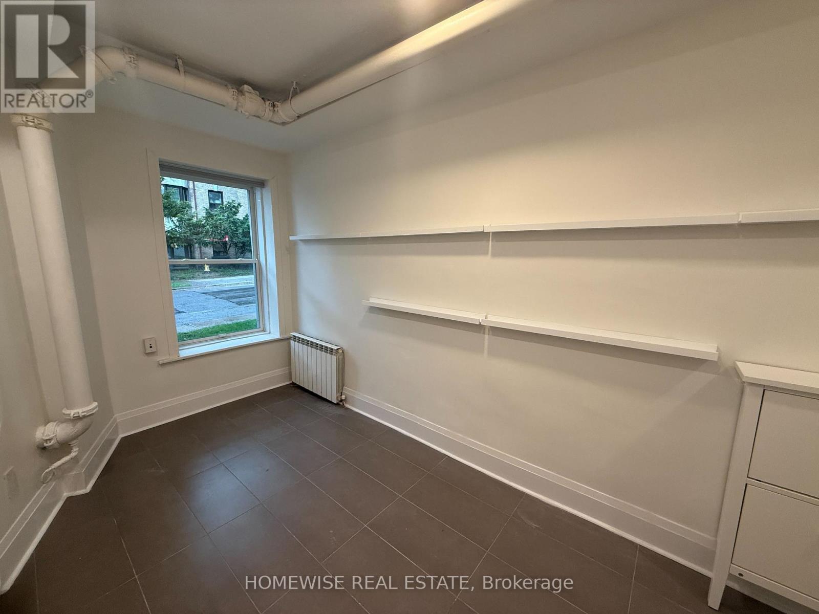 105 - 1 Triller Avenue, Toronto, Ontario  M6K 3B7 - Photo 2 - W12169868