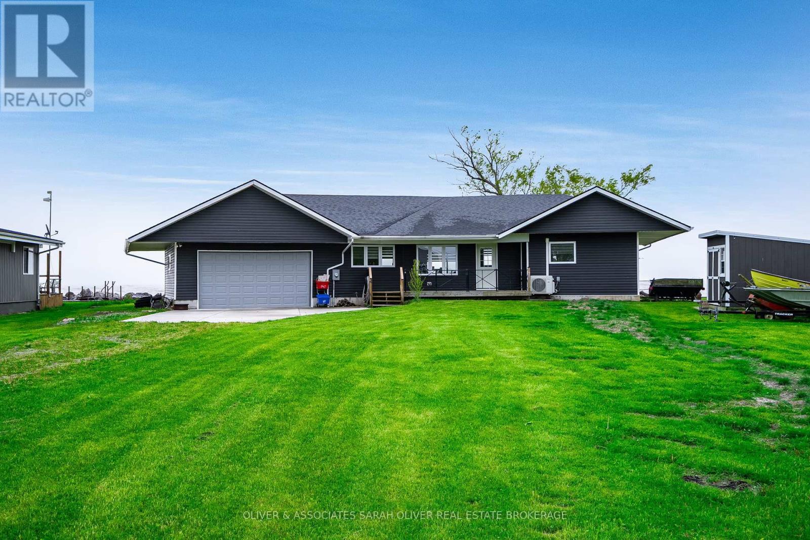 270  Cotterie Park  Leamington, Ontario Welcome to your dream waterfront retreat on the shores of Lake Erie. This beautifully designed home has been meticulously rebuilt over the past 10 years and features two spacious bedrooms and two full bathrooms. Perfectly suited for year-round living, a getaway cottage, or a  short-term rental. The open-concept layout is filled with natural light and offers unobstructed lake views from the main living spaces. A two-car garage with inside entry provides convenience, while the modern design ensures low maintenance and energy efficiency. Step outside to a covered back deck where you can relax and take in stunning sunrises over the water. With completed shoreline protection ( 2 steel break walls and large rock wall), you can fish right from your backyard and enjoy the serenity of lakeside living with peace of mind. Located just minutes from beaches, a full-service marina, and the renowned Point Pelee National Park, this home offers not only a beautiful setting but also unbeatable access to some of the regions best outdoor activities. Whether you're looking for a tranquil place to call home, a 4 season cottage or a smart investment opportunity, this Lake Erie property is the perfect blend of comfort, convenience, and natural beauty. (id:48254)