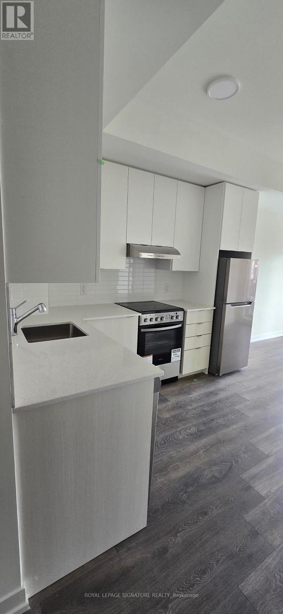 313 - 125 Canon Jackson Drive, Toronto, Ontario  M6M 0B7 - Photo 2 - W12173223