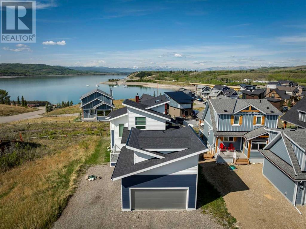 405 Cottageclub Cove, Rural Rocky View County, Alberta  T4C 1B1 - Photo 1 - A2214472