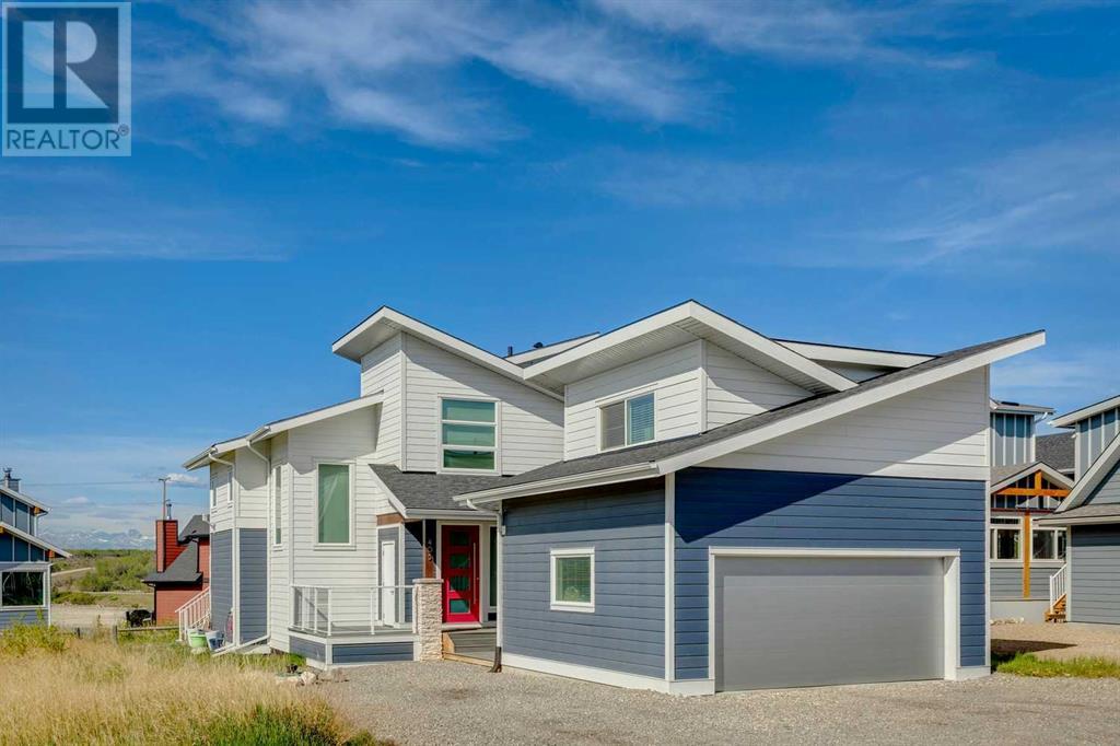405 Cottageclub Cove, Rural Rocky View County, Alberta  T4C 1B1 - Photo 2 - A2214472