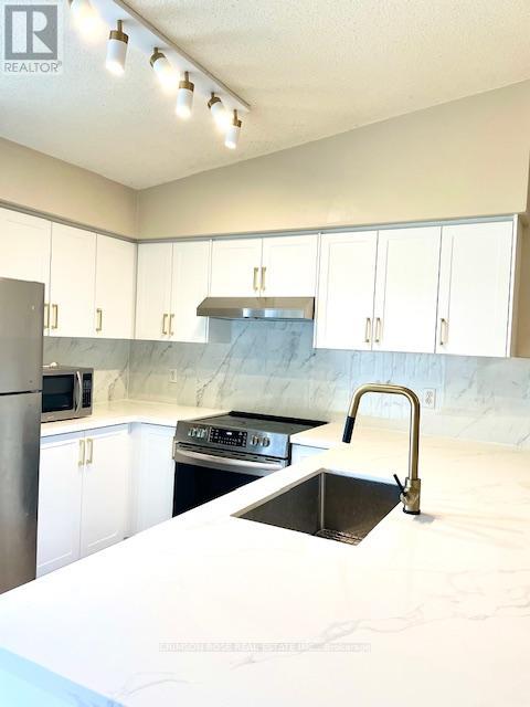 410 - 1480 Bishops Gate, Oakville, Ontario  L6M 4N4 - Photo 9 - W12176250