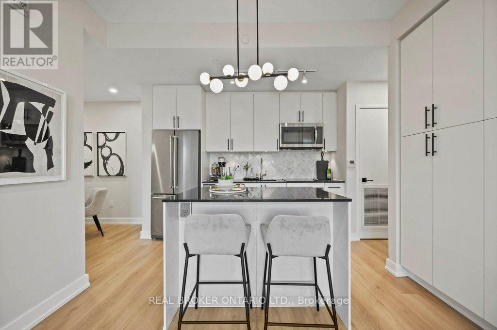 118 - 168 Sabina Drive, Oakville (Go Glenorchy), Ontario  L6H 0W5 - Photo 4 - W12176773