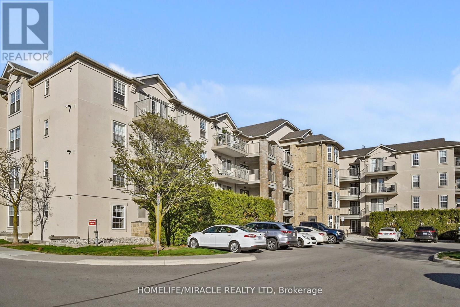 306 - 1440 Bishops Gate, Oakville, Ontario  L6M 4M9 - Photo 1 - W12177477
